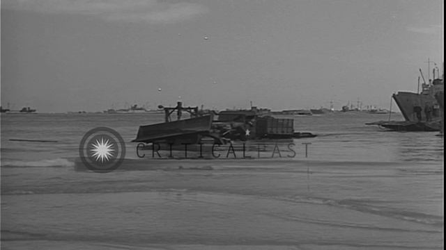 A bulldozer tows vehicles from an LCT (Landing Craft Tank) for the D-Day invasion...HD Stock Footag смотреть онлайн