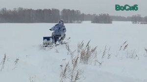 мотобуксировщик с модулем толкач по пухлому снегу