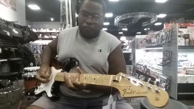 Playing a Fender Stratocaster at Guitar Center in Raleigh, North Carolina смотреть онлайн