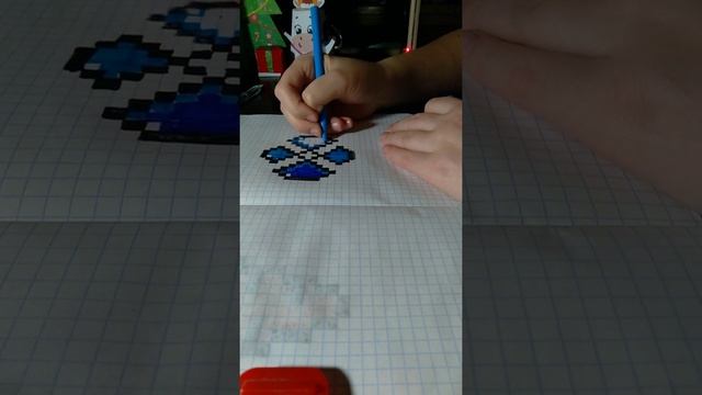 мы нарисовали в этом видео Цветочек по клеточкам. смотреть онлайн