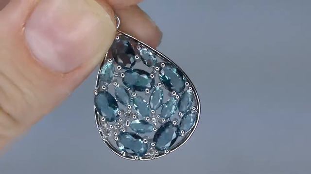 Эффектный кулон/подвеска с голубым топазом (лаб.) смотреть онлайн