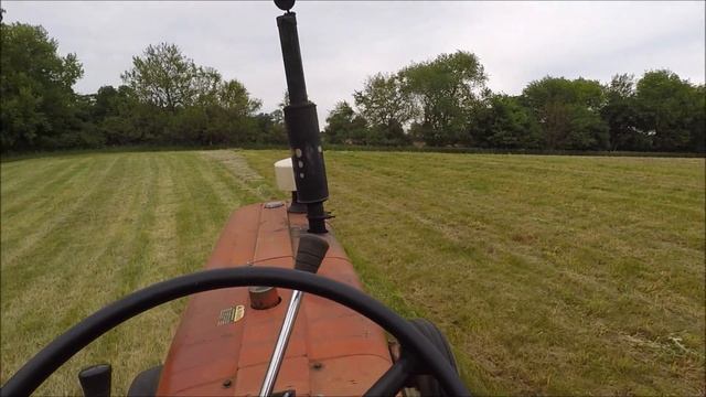 Small square baling grass hay with an International square baler смотреть онлайн
