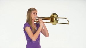 Woman Model In Studio With White Background Playing Trombone