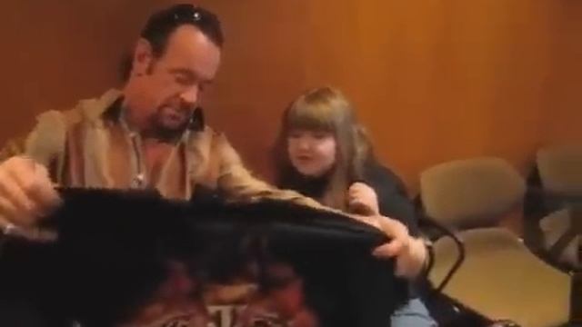 The Undertaker from the WWE breaks character and greets a young fan. смотреть онлайн