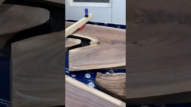 Pouring a black walnut epoxy table with black epoxy