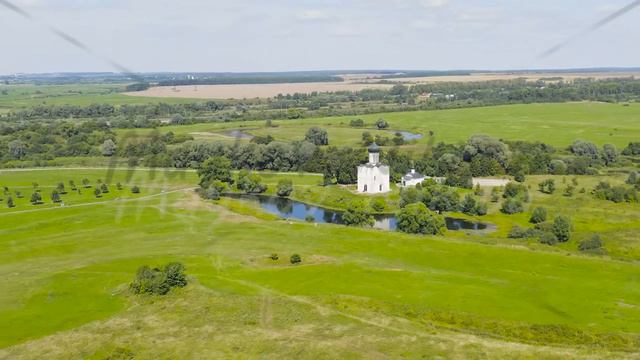 Russia, Bogolyubovo. Aerial view of Church of the Intercession on the Nerl. Orthodox church and a s смотреть онлайн