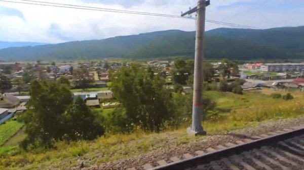 Train trip to Lake Baikal from Irkutsk to Slyudyanka station. View from the train window. Siberia