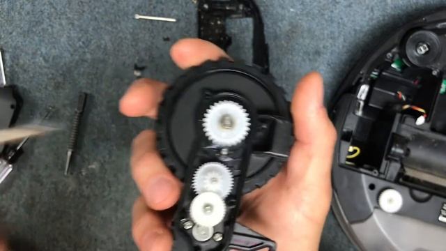 Vacuum Repairman Shows How To Take Apart A Shark Robot Vacuum Wheel For Cleaning