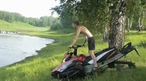 Снегоход летом по озеру/ Snowmobile on the lake in summer