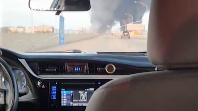 Watch: Flames, smoke erupt as cars drive past I-95 collapse смотреть онлайн