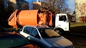 Garbage truck picks up garbage in the city. Work as a driver in a garbage truck. Russian Bllipi.