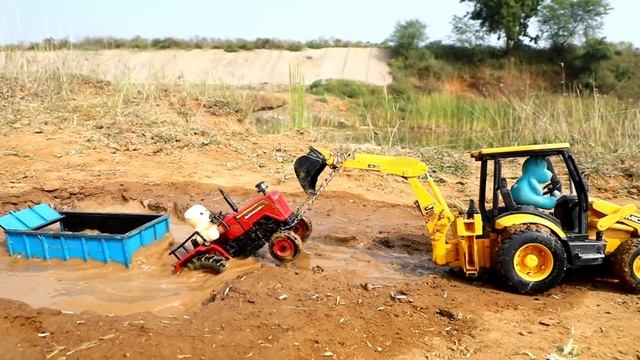 Экскаватор JCB вытаскивает трактор из ямы смотреть онлайн