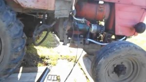 Запуск трактора  через пуско зарядное устройство.