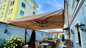 Как раскрыть уличный зонт?