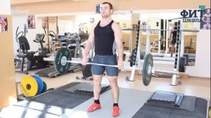 Шраги со штангой стоя: упражнение для мышц трапеции (техника выполнения)