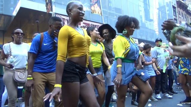 BRAZILIAN GIRLS DANCE AT BRAZILIAN CARNIVAL WITH BRAZILIAN SAMBA ORCHESTRA DRUMS MUSIC NEW YORK CIT