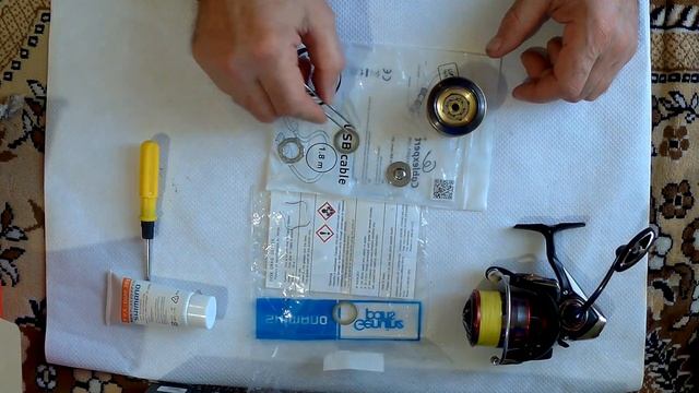 Техническое обслуживание пакета фрикциона спиннинговой безынерционной катушки