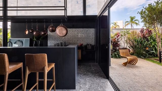 Reinforced Concrete And Metallic Structure House Design That Surrounded By Plants