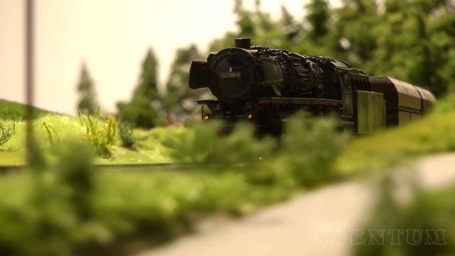 Steam Locomotive And Trains On A Model Railway Layout In HO Scale