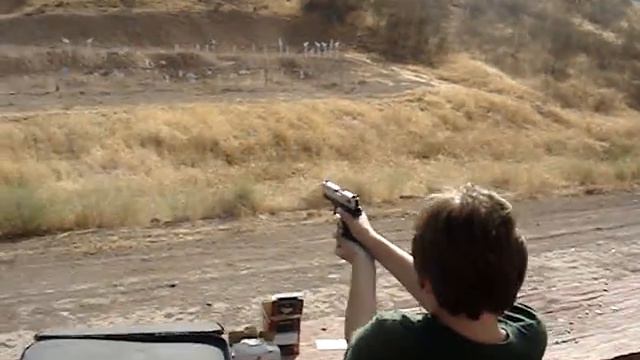 Ryan shoots his Sig Sauer .22 for the first time at the range. смотреть онлайн