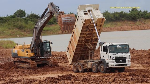 Excavator Loading Dump Truck - Volvo EC480DL Excavator, Doosan DX225LCA Excavator