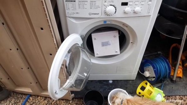 Experiment - toy washing machine in a real washing machine door open spinning as requested