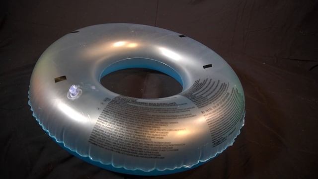 POPPING A HISSING INFLATABLE SWIM RING - PUNCTURING - DEFLATING - HISSING