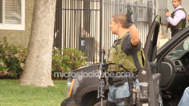 Officer With M-16 Ordering To Take Cover