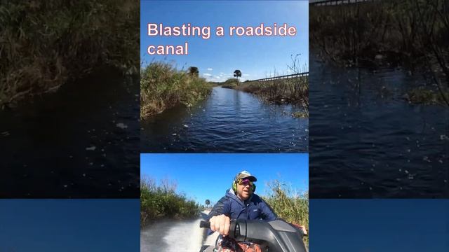 Jet Ski Blasting a Roadside Canal