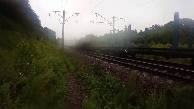 Электровоз 3ЭС5К-957 "Ермак" с составом порожних контейнерных платформ на Транссибирской магистрали смотреть онлайн