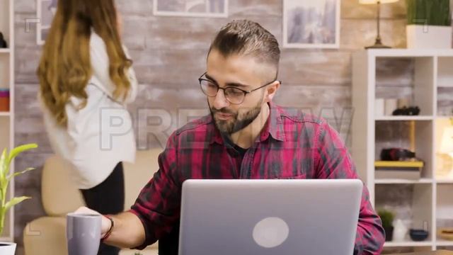 Freelancer Takes Sip Of Coffee Stock Video смотреть онлайн