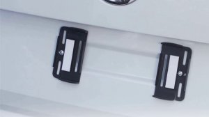 Безрамочное крепление номерного знака.