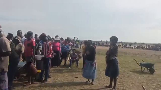 Hundreds of residents queue for water at the Sasol water trucks at Chris Hani Section. смотреть онлайн