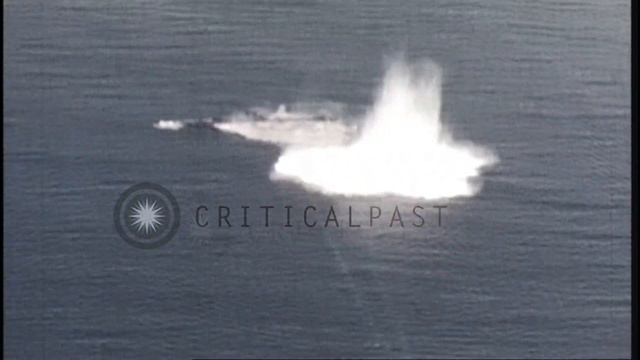 A Japanese submarine explodes and sinks leaving behind an oil slick after being h...HD Stock Footag смотреть онлайн