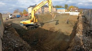 Строительство многоэтажки. Копка котлована. Подготовка основания.