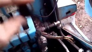 Регулировка давления в гидросистеме трактора.