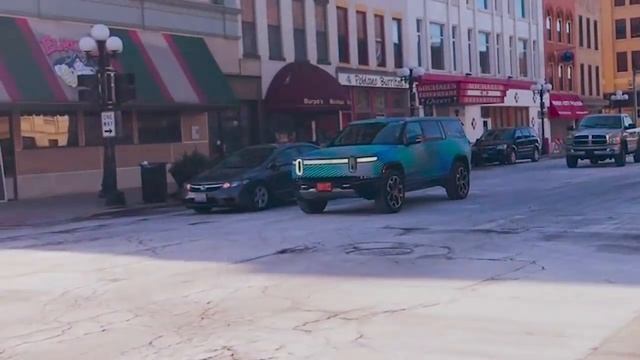 Watch now: Rivian SUV takes a test drive in downtown Bloomington смотреть онлайн