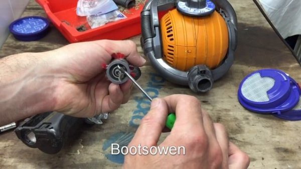 Dyson DC24: how to remove the brush sweeper head and clean it.