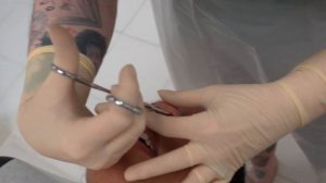 Close up Septum Piercing Procedure: Tommy T's Body Piercing Huntington Beach, CA