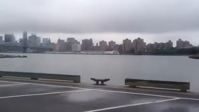 New York City skyline from the Brooklyn Navy Yard with heavy clouds, but no rain. смотреть онлайн