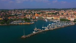 Desenzano del Garda City Tourist Place on Lake Garda, Italy. Aerial drone 4K video. Relaxing Music