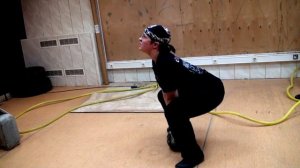 Приседания с гирей.