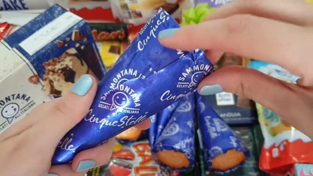Unwrapping Chocolate Ice Cream Cone With Almonds смотреть онлайн
