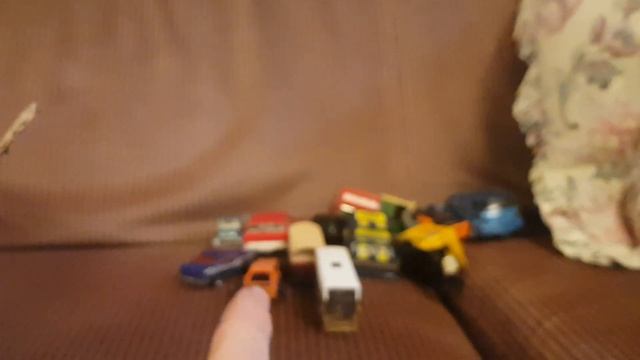 A collection of toy cars from inside a cardboard box смотреть онлайн
