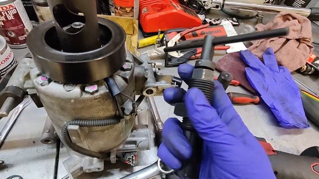 A/C compressor shaft seal replacement.