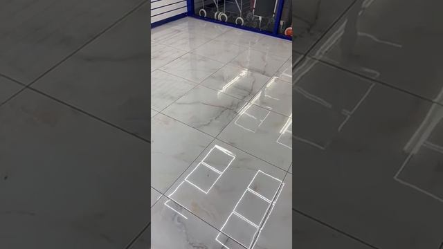 Onyx White/Gold Porcelain Tile in a showroom смотреть онлайн