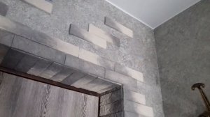 Отделка искуственным камнем дверной проём.