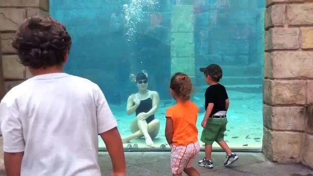 Female Diver Underwater Performs Cool Tricks Underwater