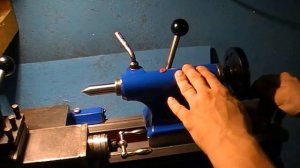 Как извлечь центр из задней бабки токарного станка  ?