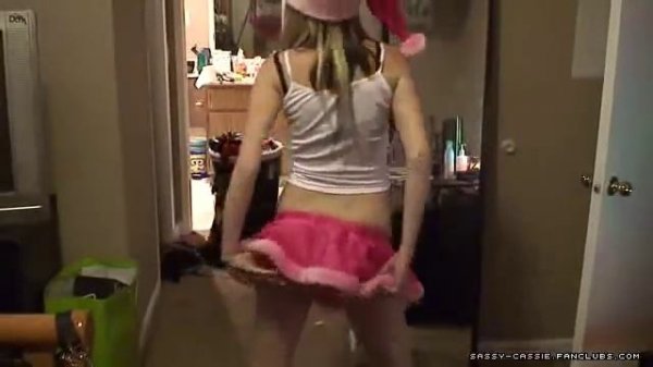 Cute Pregnant Girl showing her Christmas Outfit